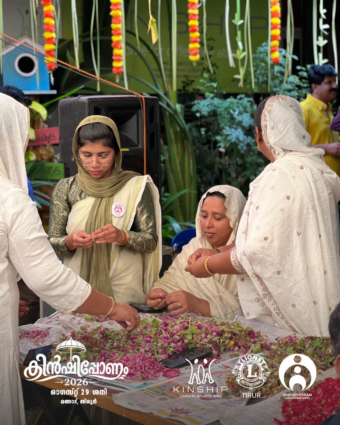 Participants preparing a traditional Onam flower arrangement